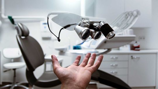 A dentist with his glasses